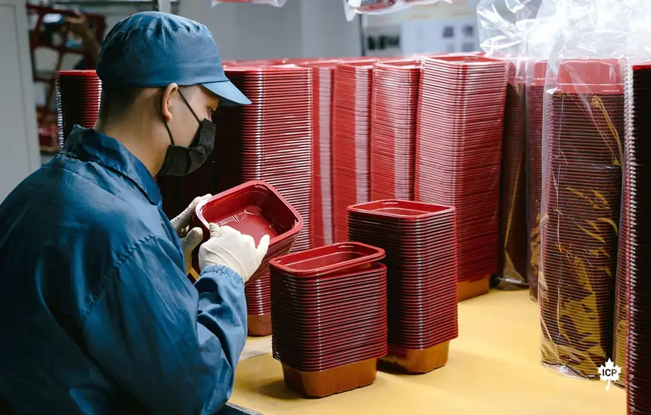 A worker on a factory line