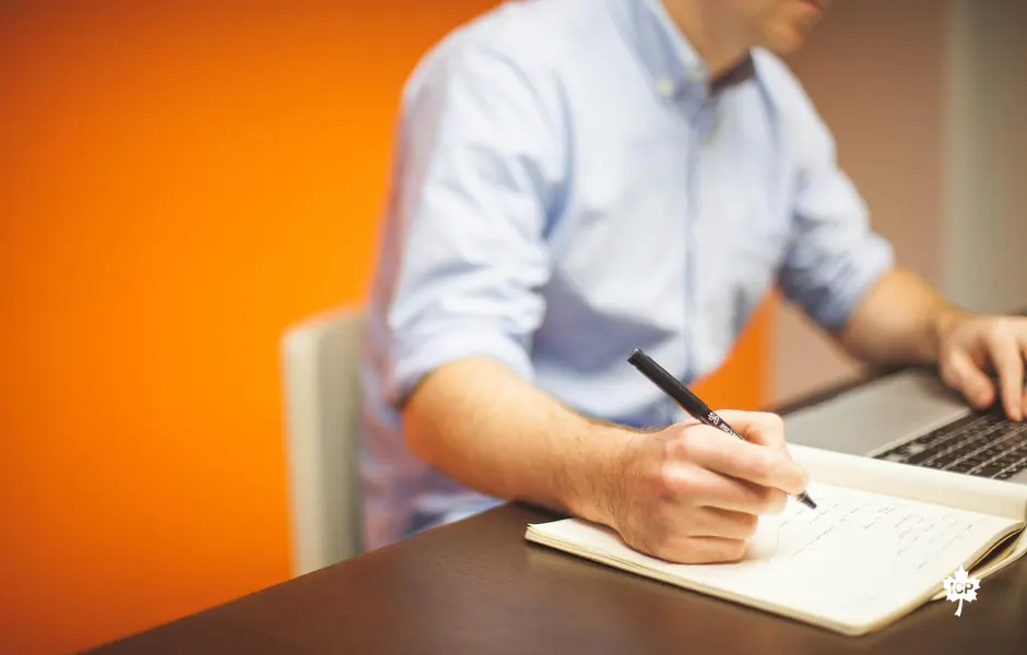 Person writing a plan