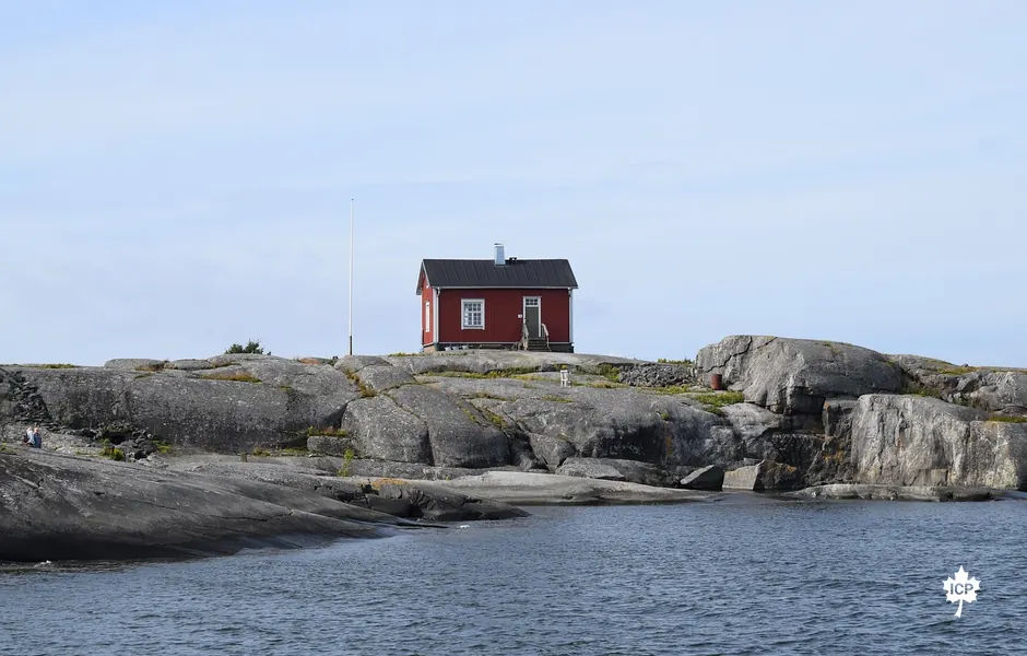 A small house by the water